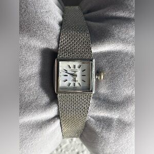 Longines mesh band stainless steel ladies watch.